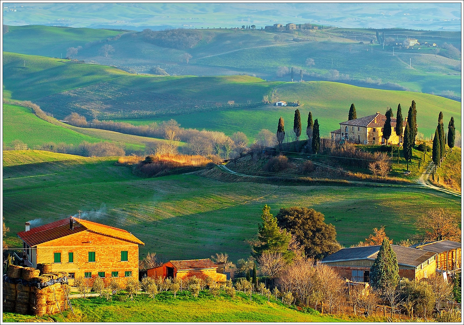 Wide view of rolling Tuscan countryside hills